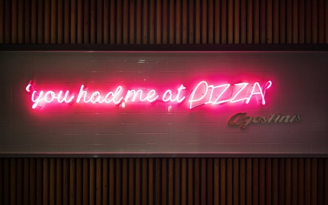 Agostini's 'You had me at pizza' neon sign in hotel lobby