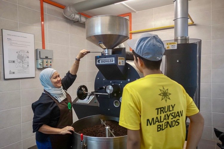 Coffee roasters KL team roasting beans in the Bohler