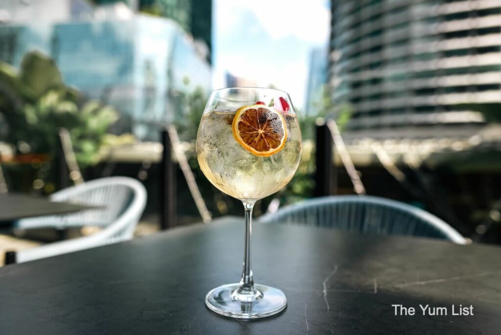 Indian Restaurant & Bar Rooftop Kuala Lumpur Gin and Tonic in bowl glass with lemon garnish