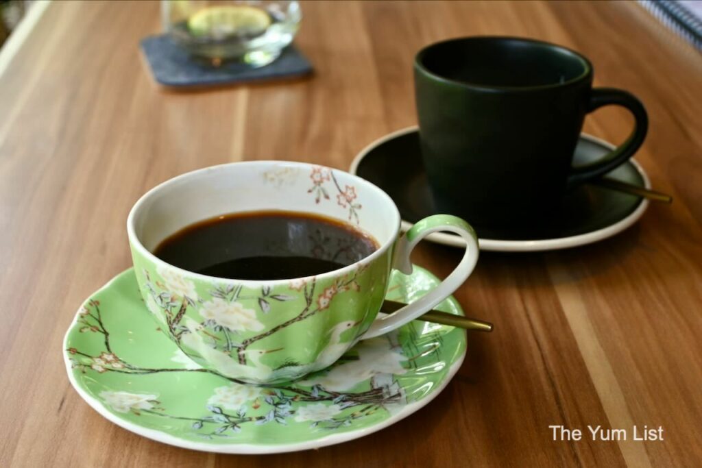 MAZI Greek Taverna KL, The Stories of Bukit Tunku Coffee in green cup