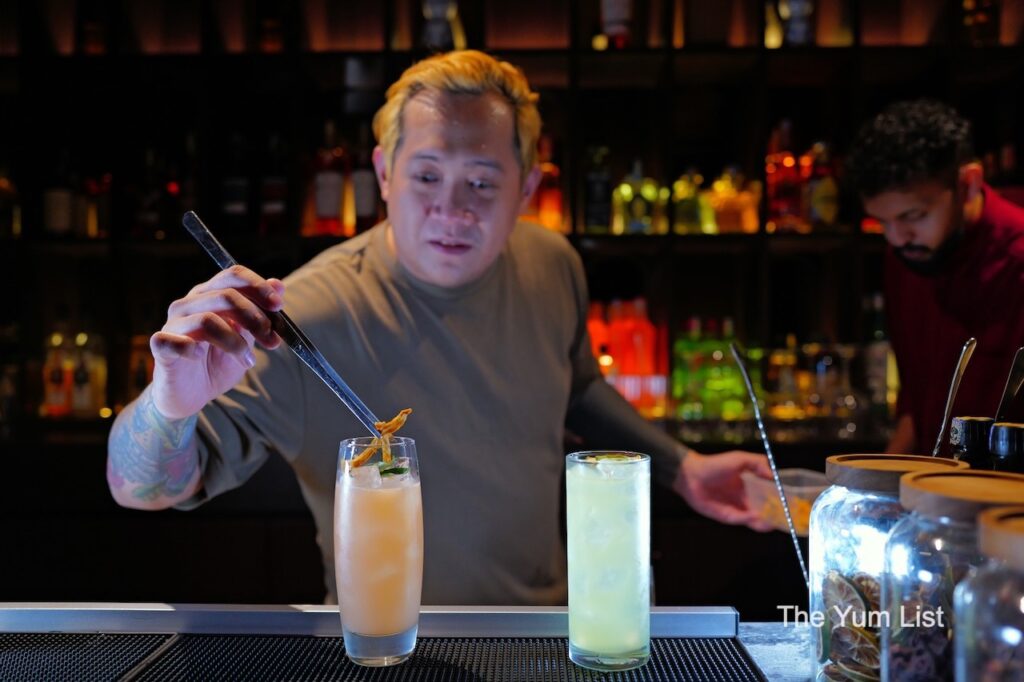 Hidden Cocktail Bar KL bartender Adding the Final Touch to a cocktail