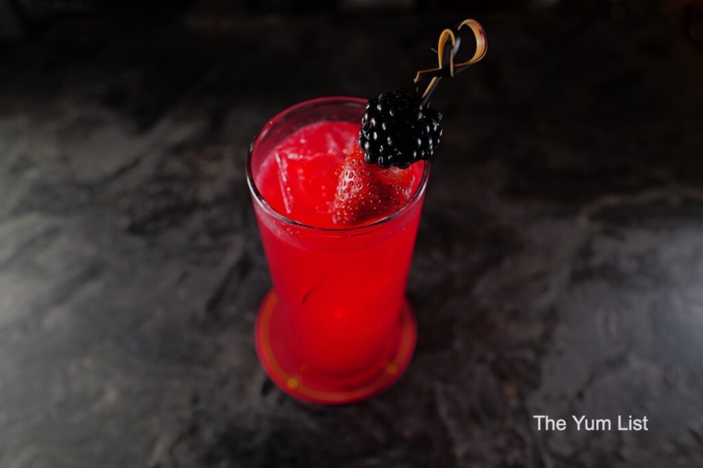 Desire Speakeasy Plaza Batai Five Berry Delight with blackberry and strawberry garnish