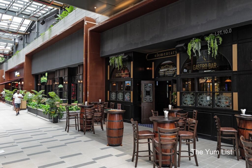 British Restaurant & Pub Kuala Lumpur covered outdoor terrace with high tables and stool seating