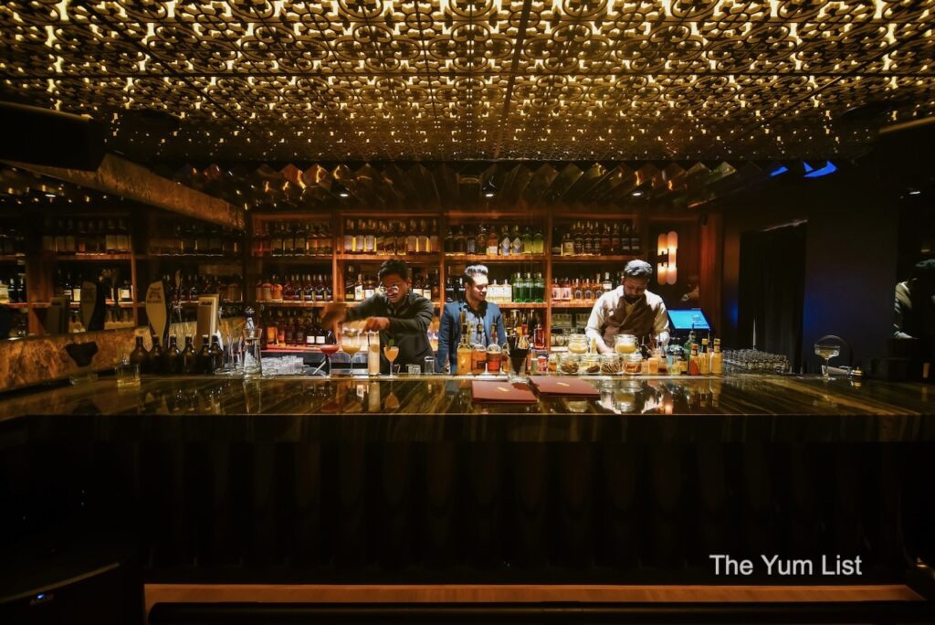 The First Chapter Speakeasy New Location - three bartenders mixing drinks