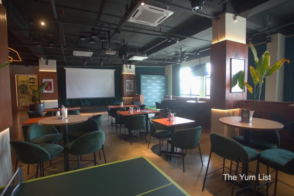 Wedge Range Golf Bar & Social Club, Petaling Jaya -dining tables with green chairs