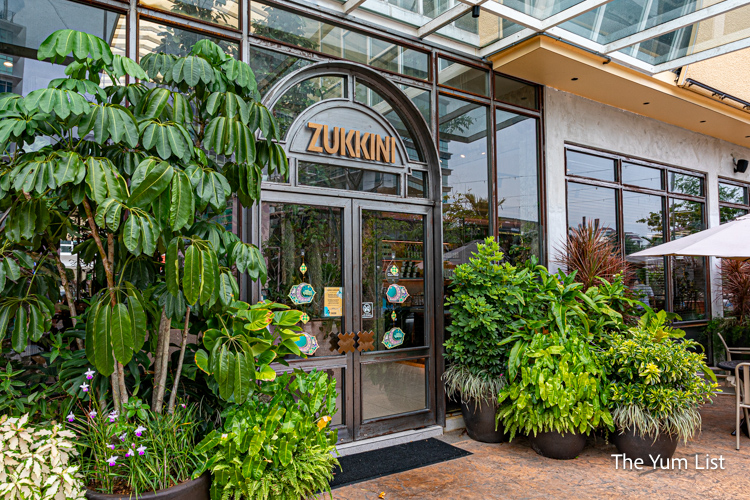 Cafe entrance surrounded by plants