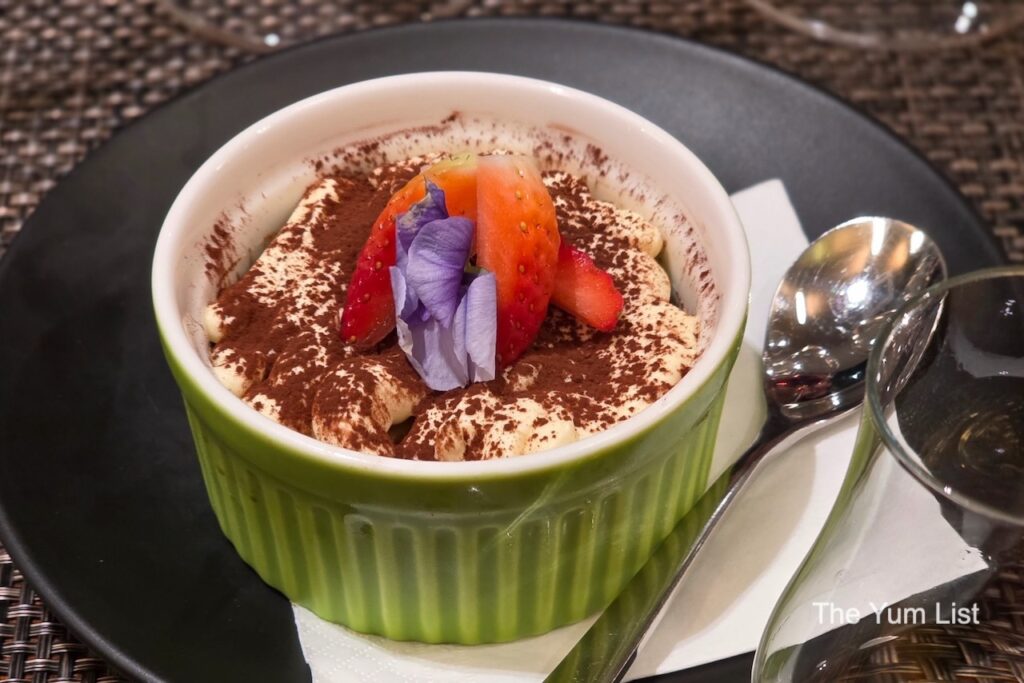Tiramisu in a green bowl